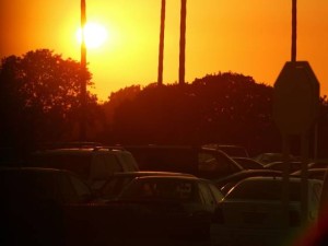 a sunset over a california parking lot.